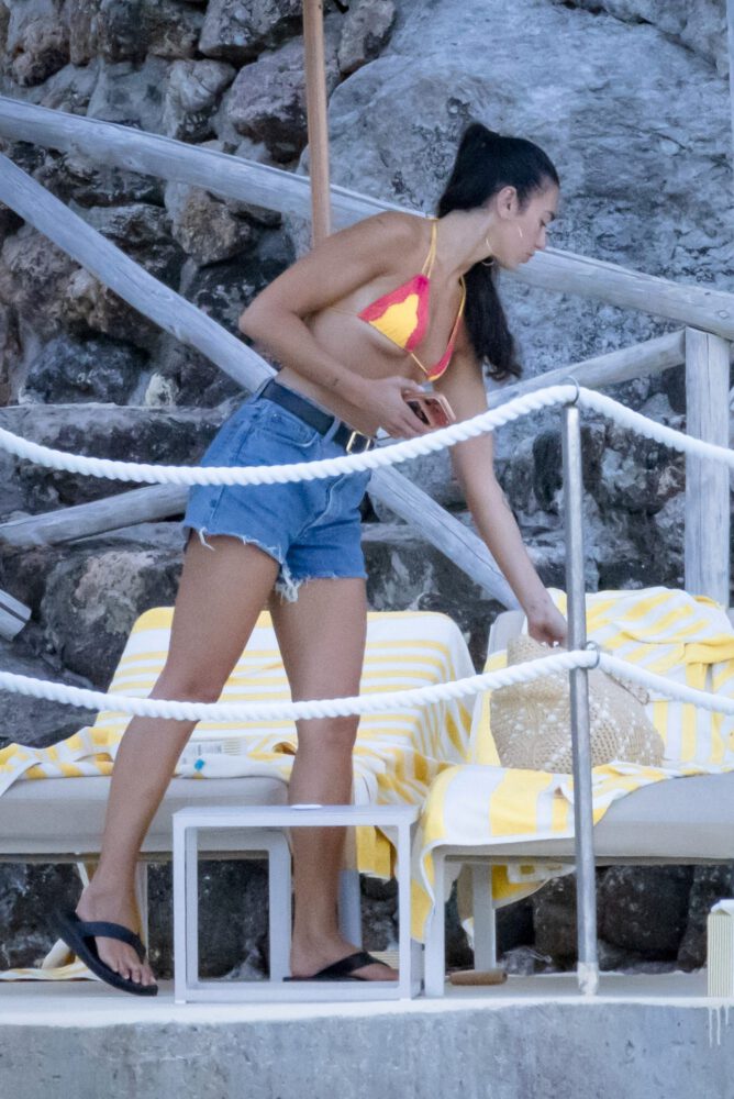 Dua Lipa Sizzles in Minuscule Yellow Bikini Exposing Her Curvy Ass During Sizzling Italian Vacation