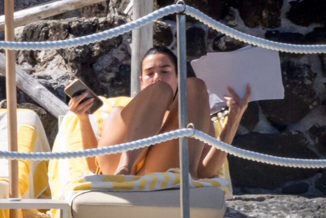 Dua Lipa Sizzles in Minuscule Yellow Bikini Exposing Her Curvy Ass During Sizzling Italian Vacation