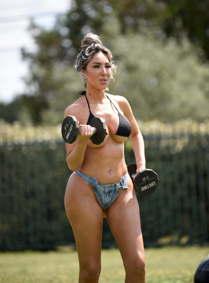 Farrah Abraham Sizzles in Skimpy Bikini and Shorts Exposing Her Voluptuous Boobs and Curvy Ass