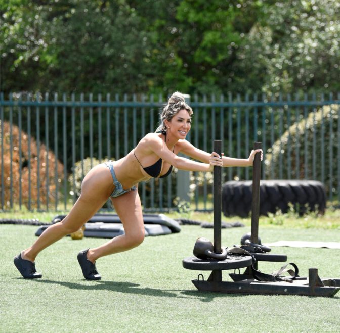 Farrah Abraham Sizzles in Skimpy Bikini and Shorts Exposing Her Voluptuous Boobs and Curvy Ass