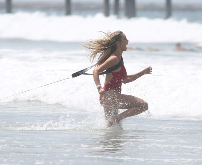 Hassie Harrison Sizzles in Drenched Baywatch Swimsuit Exposing Voluptuous Boobs and Sultry Booty