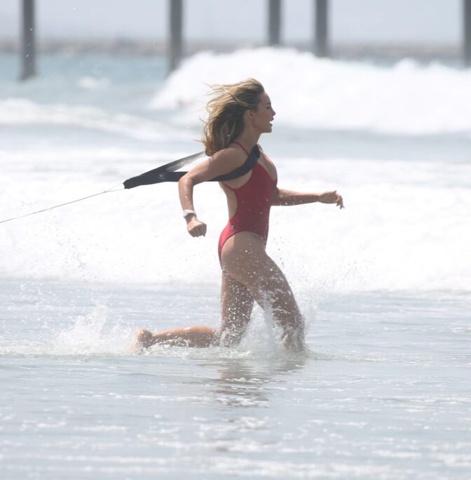 Hassie Harrison Sizzles in Drenched Baywatch Swimsuit Exposing Voluptuous Boobs and Sultry Booty