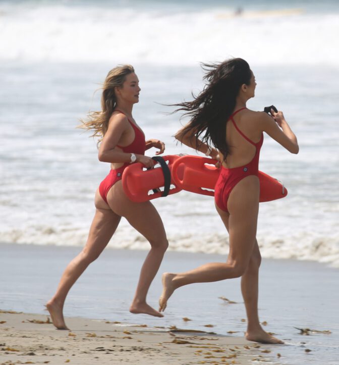 Hassie Harrison Sizzles in Drenched Baywatch Swimsuit Exposing Voluptuous Boobs and Sultry Booty