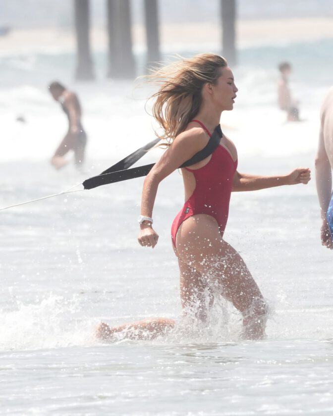 Hassie Harrison Sizzles in Drenched Baywatch Swimsuit Exposing Voluptuous Boobs and Sultry Booty