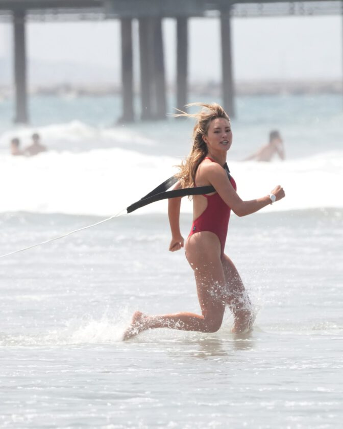 Hassie Harrison Sizzles in Drenched Baywatch Swimsuit Exposing Voluptuous Boobs and Sultry Booty