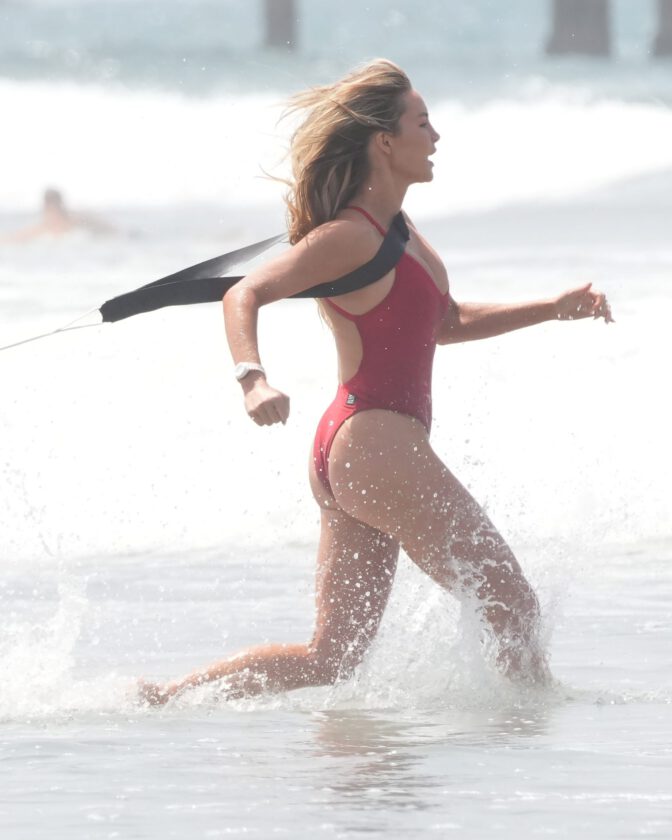 Hassie Harrison Sizzles in Drenched Baywatch Swimsuit Exposing Voluptuous Boobs and Sultry Booty
