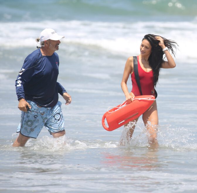 Hassie Harrison Sizzles in Drenched Baywatch Swimsuit Exposing Voluptuous Boobs and Sultry Booty