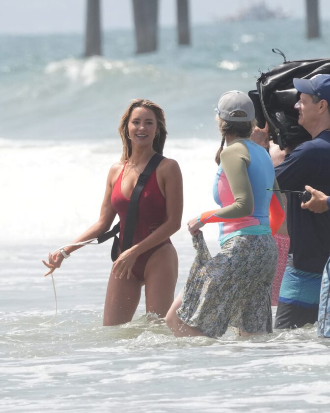 Hassie Harrison Sizzles in Drenched Baywatch Swimsuit Exposing Voluptuous Boobs and Sultry Booty