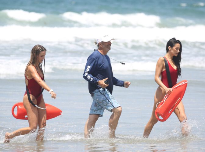 Hassie Harrison Sizzles in Drenched Baywatch Swimsuit Exposing Voluptuous Boobs and Sultry Booty