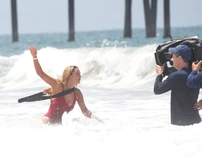 Hassie Harrison Sizzles in Drenched Baywatch Swimsuit Exposing Voluptuous Boobs and Sultry Booty