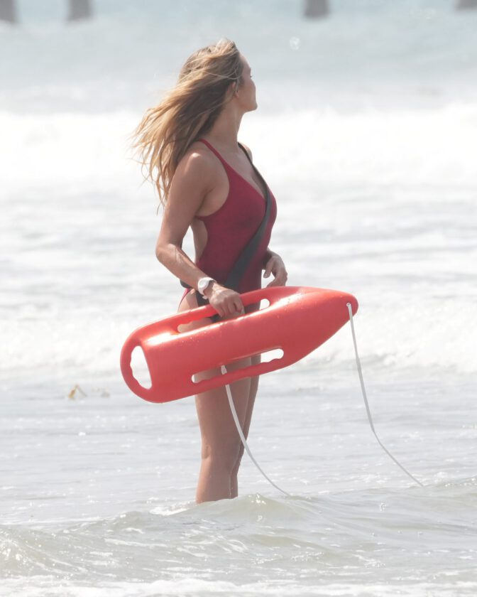 Hassie Harrison Sizzles in Drenched Baywatch Swimsuit Exposing Voluptuous Boobs and Sultry Booty