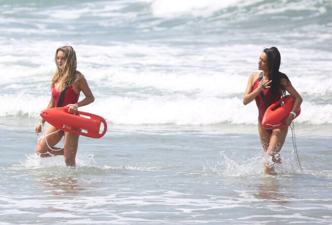 Hassie Harrison Sizzles in Drenched Baywatch Swimsuit Exposing Voluptuous Boobs and Sultry Booty