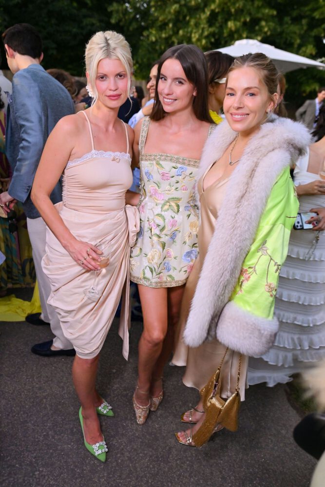 Sienna Miller Flaunts Her Voluptuous Boobs in a Sultry Fur and Silk Ensemble that Exposes Her Sexy Cleavage to the Fullest
